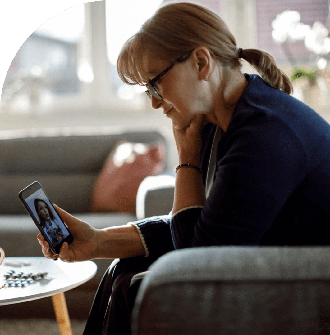 Person in glasses using phone