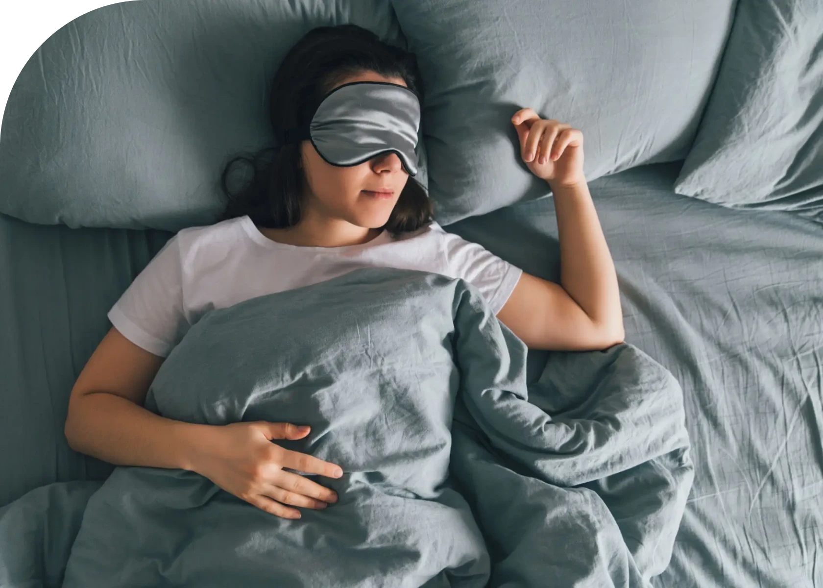 Person resting in bed with mask