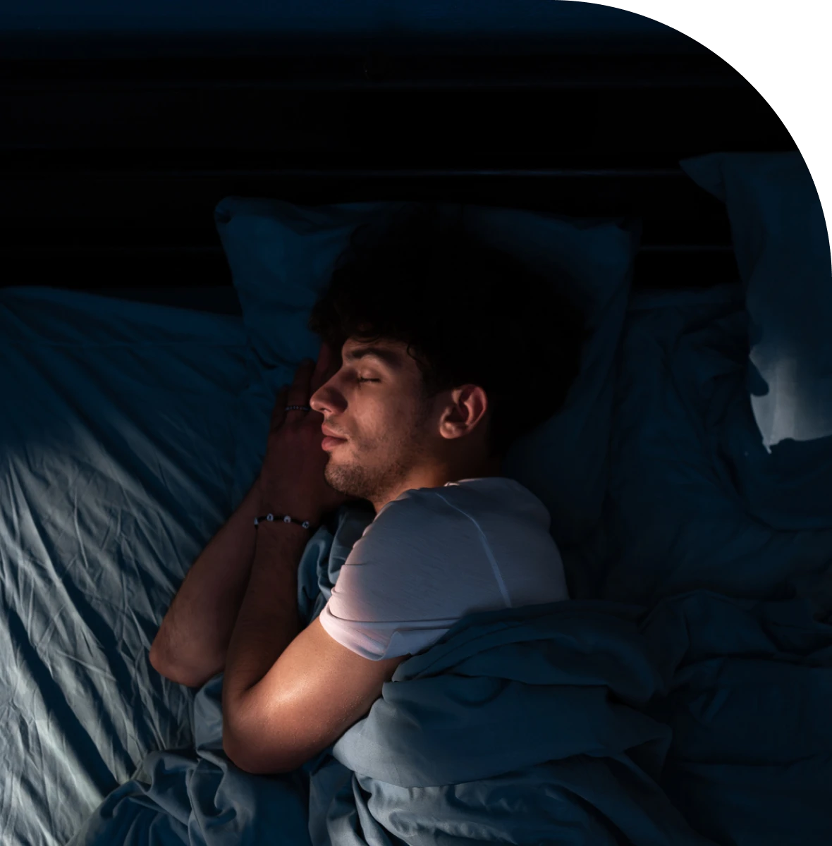Man sleeping peacefully in bed
