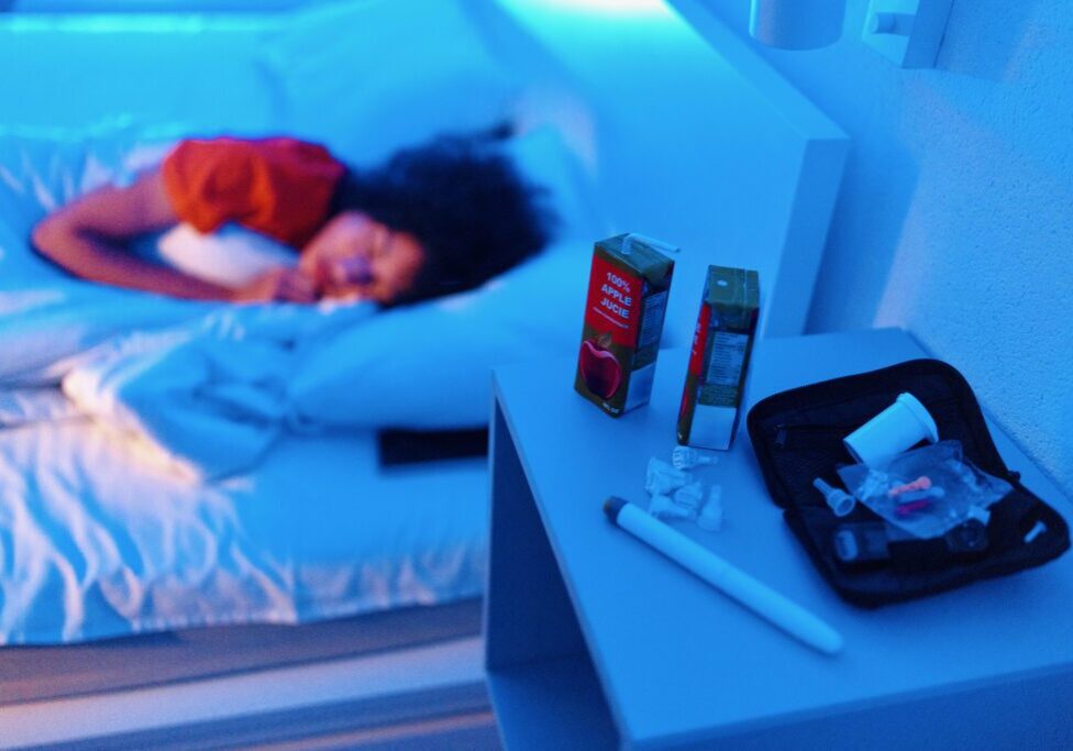 Boy with diabetes sleeping at his bed at night